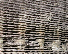 heater repair furnace repair central gas furnace repair. A close view of corroded cooling fins on an indoor evaporator coil